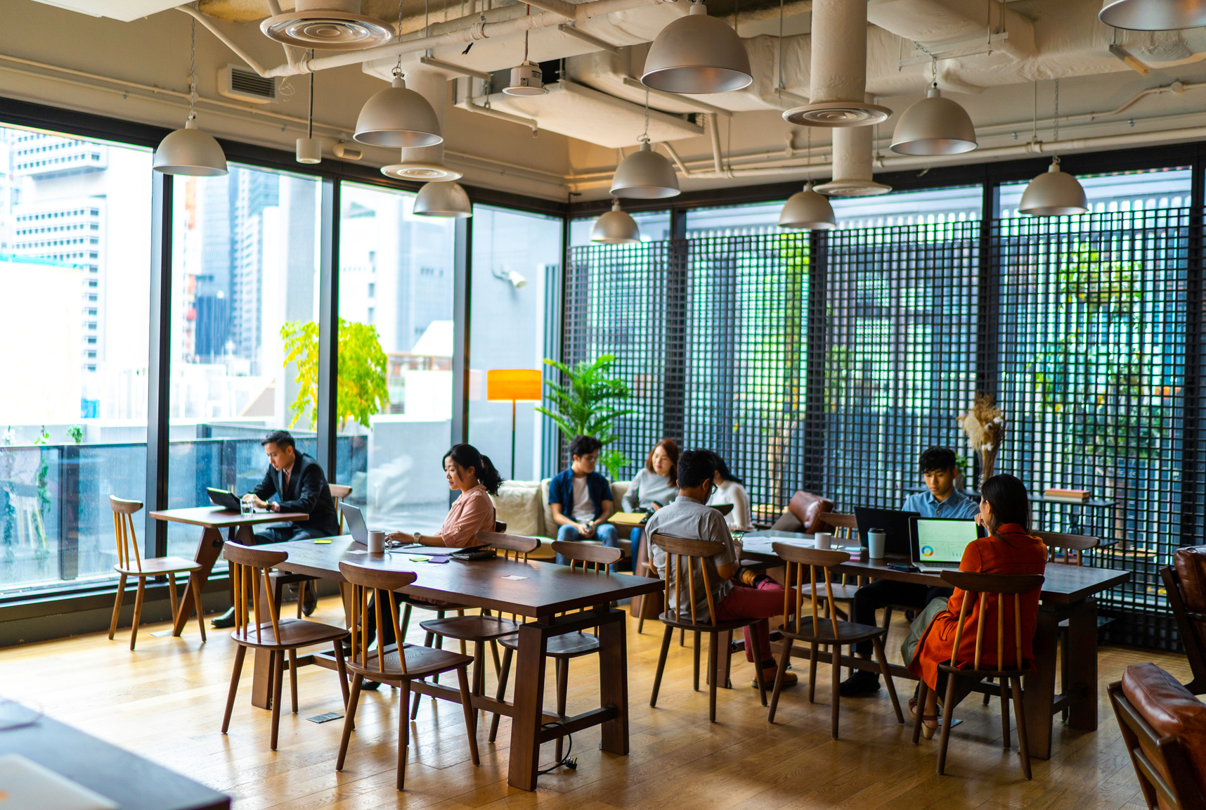 Asians Millennials busy working in co-working space.